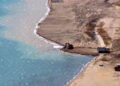 The deputy asks to check which government agency allowed construction companies to dump soil from dug pits into Lake Issyk-Kul