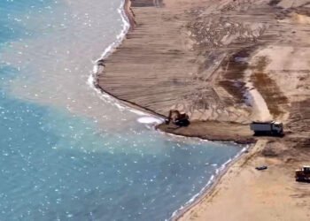 The deputy asks to check which government agency allowed construction companies to dump soil from dug pits into Lake Issyk-Kul