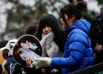 Debt-laden Japan should review spending on gender equality, survey finds