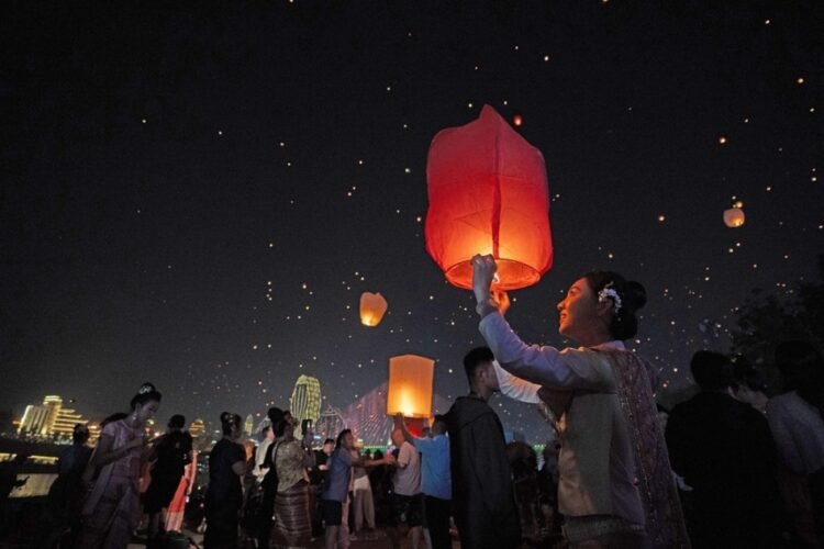 People fly Kongming lanterns in Jinghong, China’s Yunnan