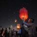 People fly Kongming lanterns in Jinghong, China’s Yunnan
