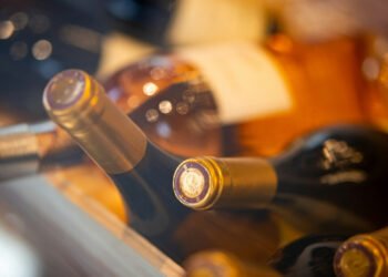 Shooting at Trump event: Woman collects wine bottles