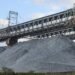 How much will the mine pay the State to process the exposed mineral material?