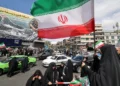 After Trump pauses war, Iranians fly flags of victory not surrender