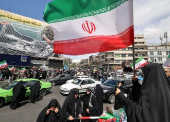 After Trump pauses war, Iranians fly flags of victory not surrender
