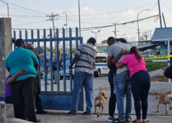 Trinidad police officer murdered in station, 68 guns taken