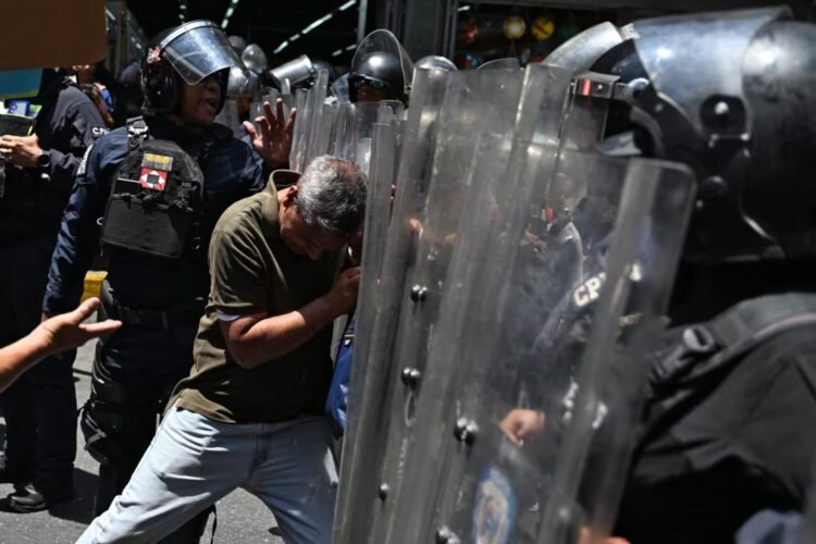 Police throw gas at protesters trying to reach the presidential palace in Venezuela