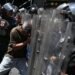 Police throw gas at protesters trying to reach the presidential palace in Venezuela