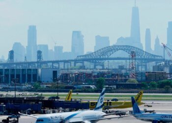 A United Airlines plane caught a wheel on a truck and a pole while landing