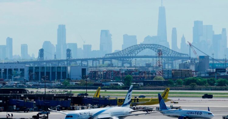 A United Airlines plane caught a wheel on a truck and a pole while landing