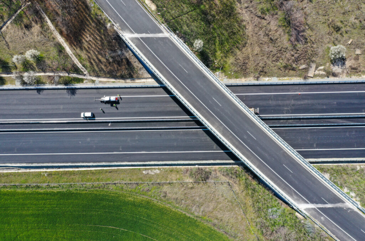 Asphalt of “Danube waves”, with a thickness of 2-3 cm and overgrown grass, s…