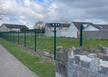 ‘It just seems bizarre’ – council intervenes as public green where children play is fenced off without permission