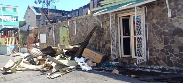 One in custody following massive fire in Roseau