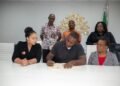 Housing beneficiaries at Bellevue Chopin sign documents for issuance of certificates of title