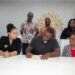 Housing beneficiaries at Bellevue Chopin sign documents for issuance of certificates of title