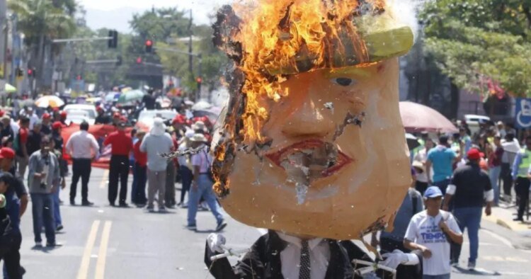 Figure of Donald Trump burned during Labor Day march in SPS