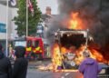 Demonstrations following a stabbing incident in Belfast result in riots, buses set on fire and roads blocked