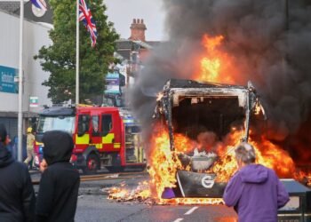 Demonstrations following a stabbing incident in Belfast result in riots, buses set on fire and roads blocked