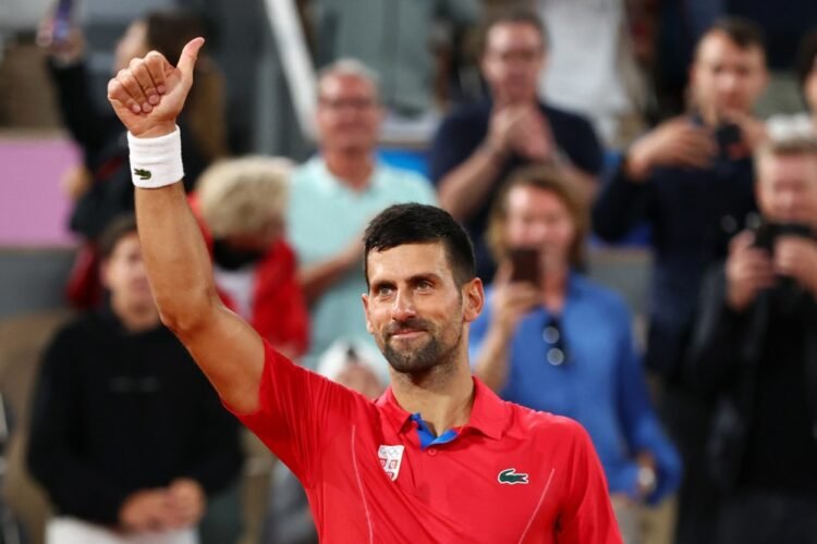 PHOTO | Djokovic unfurled the black and white flag at the finish line after Hamilton’s victory in Barcelona