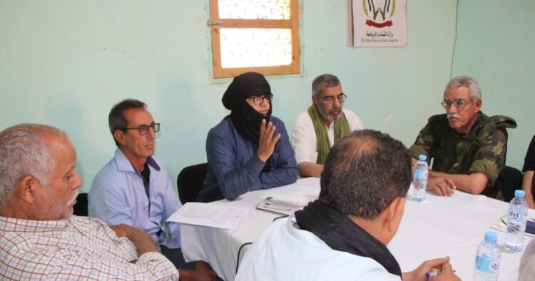The official of the Secretariat of Political Organization supervises a meeting of the national committee supervising the Holidays in Peace program