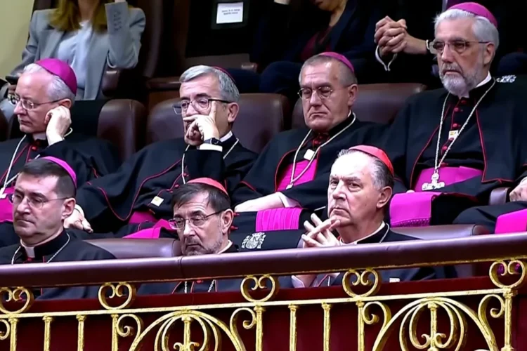 A member of the clergy appears to nod off during the Pope’s speech in the Congress of Deputies