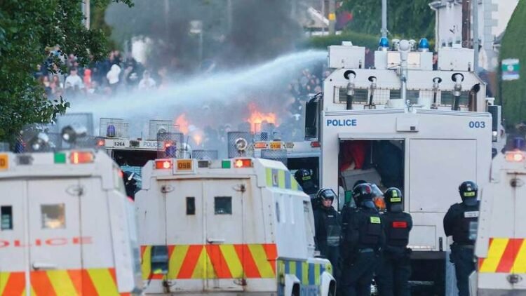 Violence against migrants brings Northern Ireland back to ‘the darkest chapters of its past’