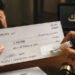 An Arab uses an “imaginary questioner” to write a check for 1.7 million dirhams