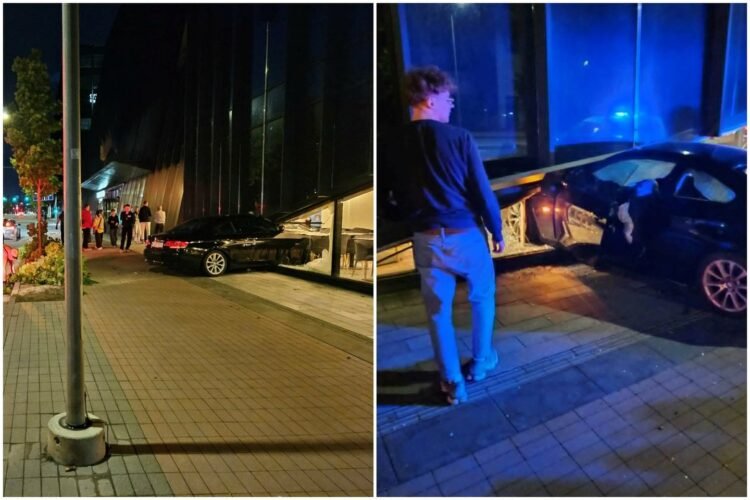 A BMW drove into the hotel restaurant in Vilnius after breaking the glass window wall