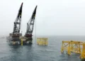 Oil prices fell by about 1 percent