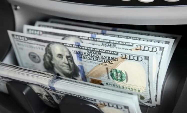 The dollar is heading for its largest monthly gain in a year