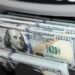 The dollar is heading for its largest monthly gain in a year