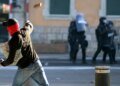 Protesters smash windows and set car ablaze in anti-G7 protest in Geneva