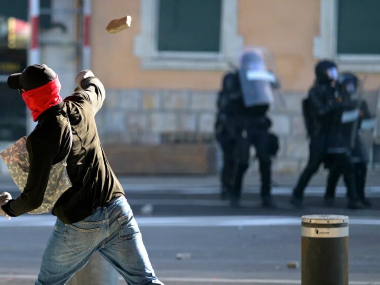 Protesters smash windows and set car ablaze in anti-G7 protest in Geneva