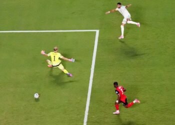 Football: Soccer-Austria draw with Algeria in World Cup thriller to progress and send Iran home