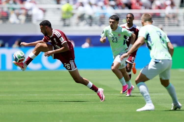 Qatar earn first ever WCup point with late goal
