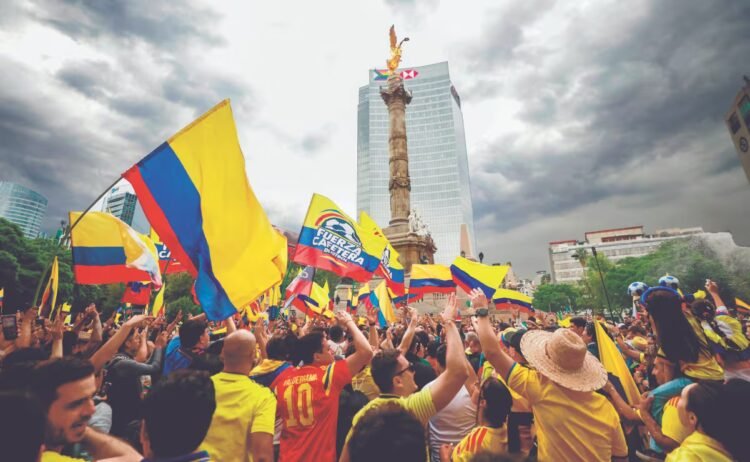 Colombian fans have a party at the Ángel de la Independencia before the debut against Uzbekistan