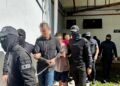 Twenty-three men plead not guilty to organised crime charges in Kuching