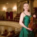 A young musician with a violin that is more than three centuries old