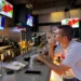 At a UFC watch party, cheers for the fight and dismay over the war in Iran