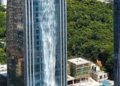 A waterfall flows down from the skyscraper, but the reason is very different.