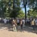 How many people did the opposition protest outside parliament gather? Police data