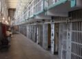 Hundreds of inmates of a prison climbed onto the roof and set fire to the buildings. They allege that they are tortured and abused by the guards
