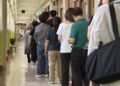 At polling stations, voters look beyond local pledges