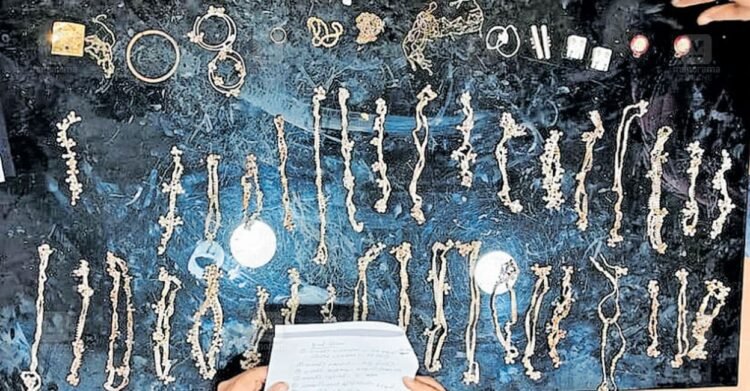When I opened the heavy plastic tin I found while cleaning the ditch, I saw a collection of silver! | Silver ornaments found in Pooyappally