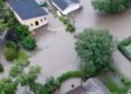 What caused the devastating flooding in parts of Manitoba?