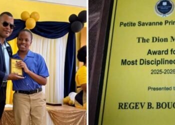 Acting Sergeant Dion Moses presents discipline award at Petite Savanne Primary graduation