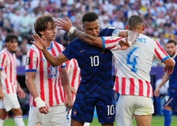 Football: Soccer-France survive Paraguay’s prickly test but warning lights flash