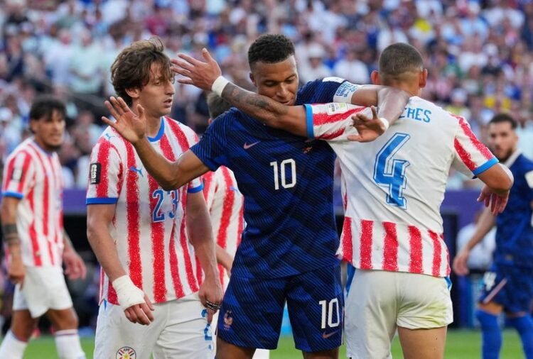 Football: Soccer-France survive Paraguay’s prickly test but warning lights flash