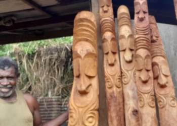 Ambrym carver crafts hardwood entrance carvings for resorts