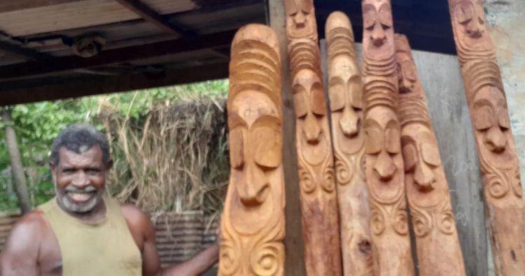 Ambrym carver crafts hardwood entrance carvings for resorts